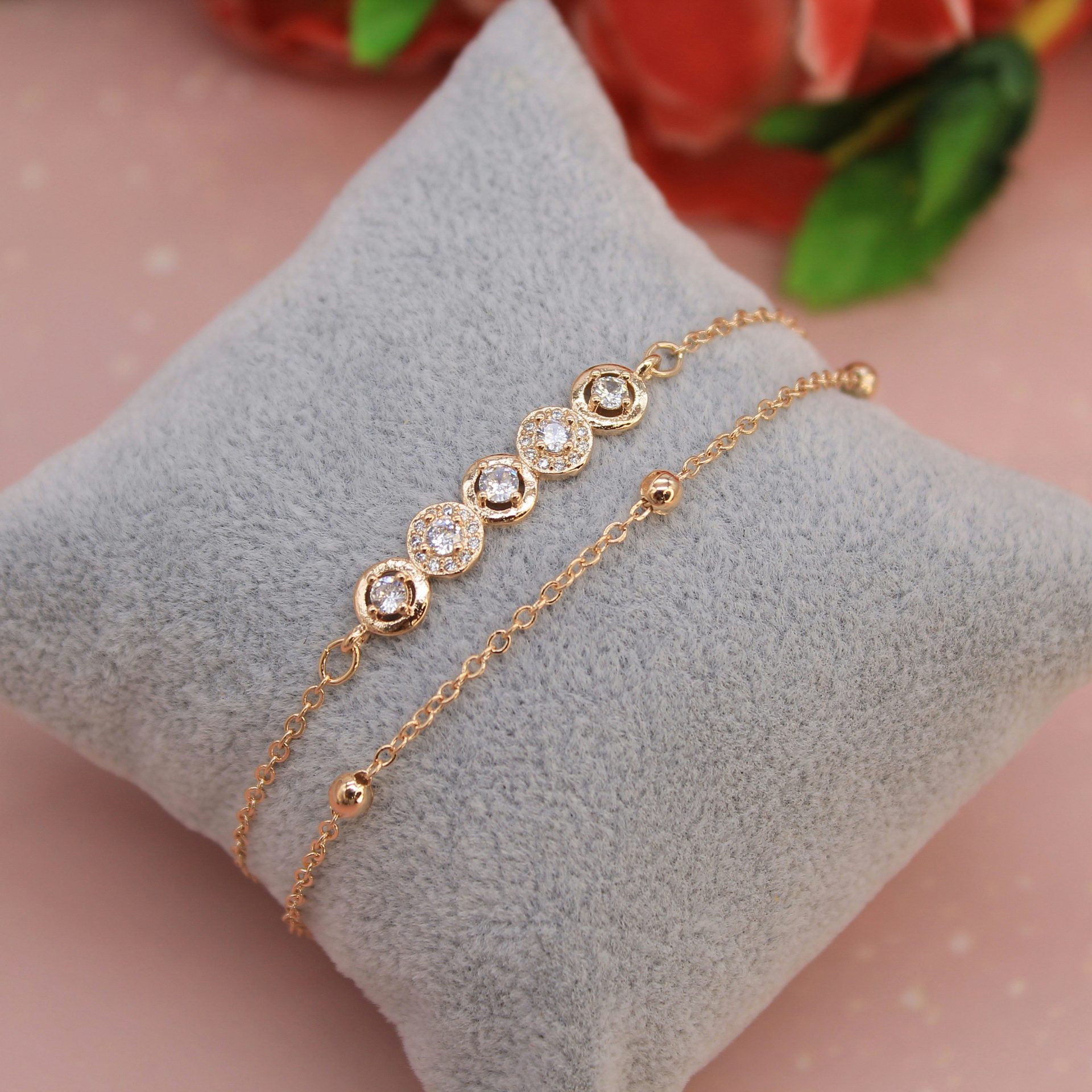 a close up of a bracelet on a pillow