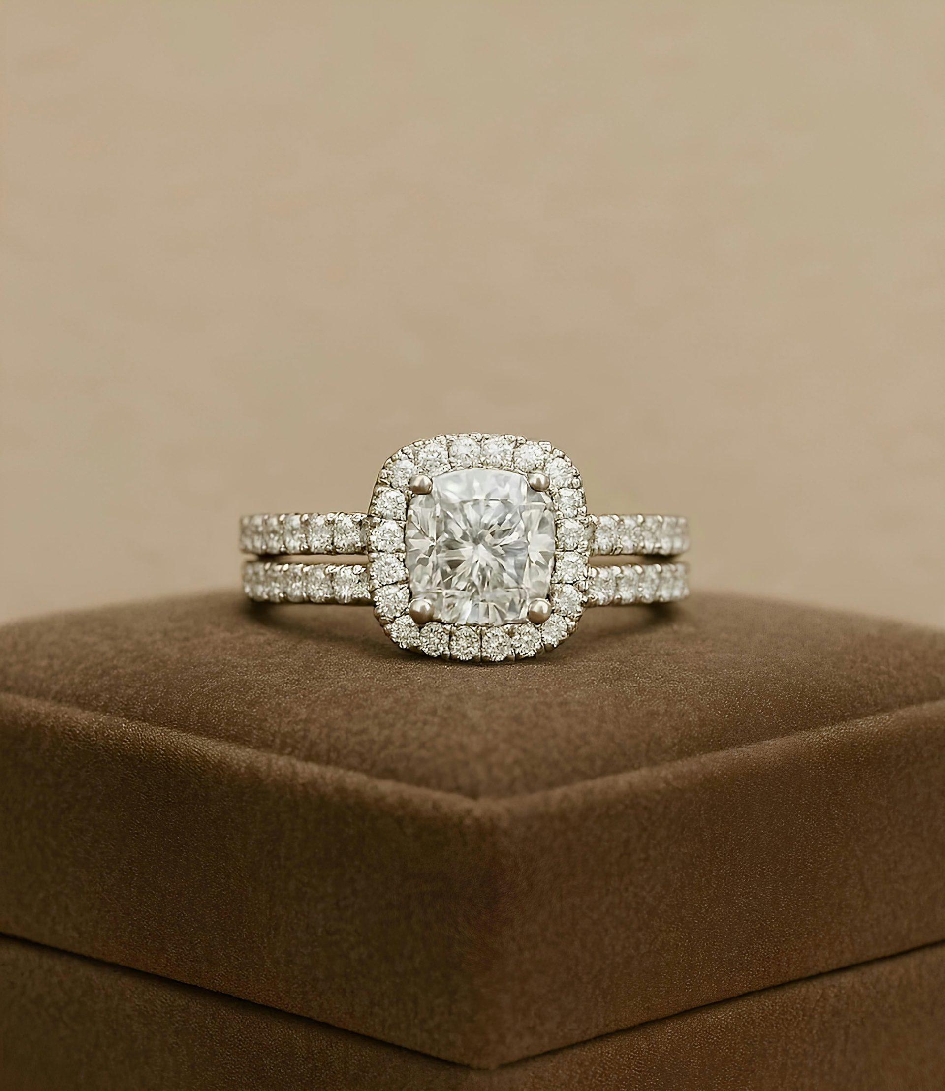 A diamond ring set sits on a display box.