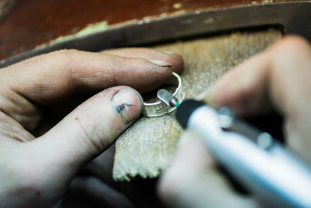 a person is putting a ring on another person's finger